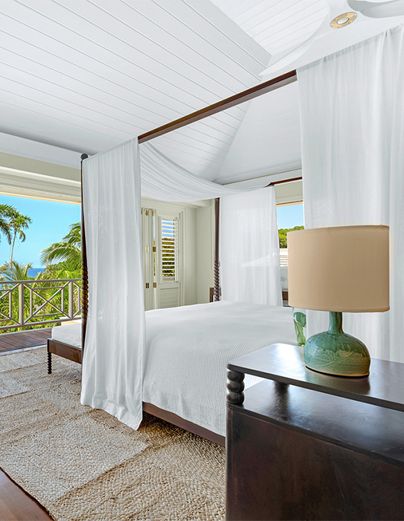 Ralph Lauren-designed Oceanfront Room with a four-poster bed and balcony